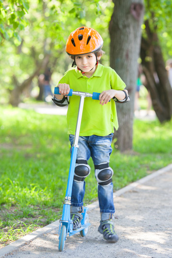 Child on store a scooter